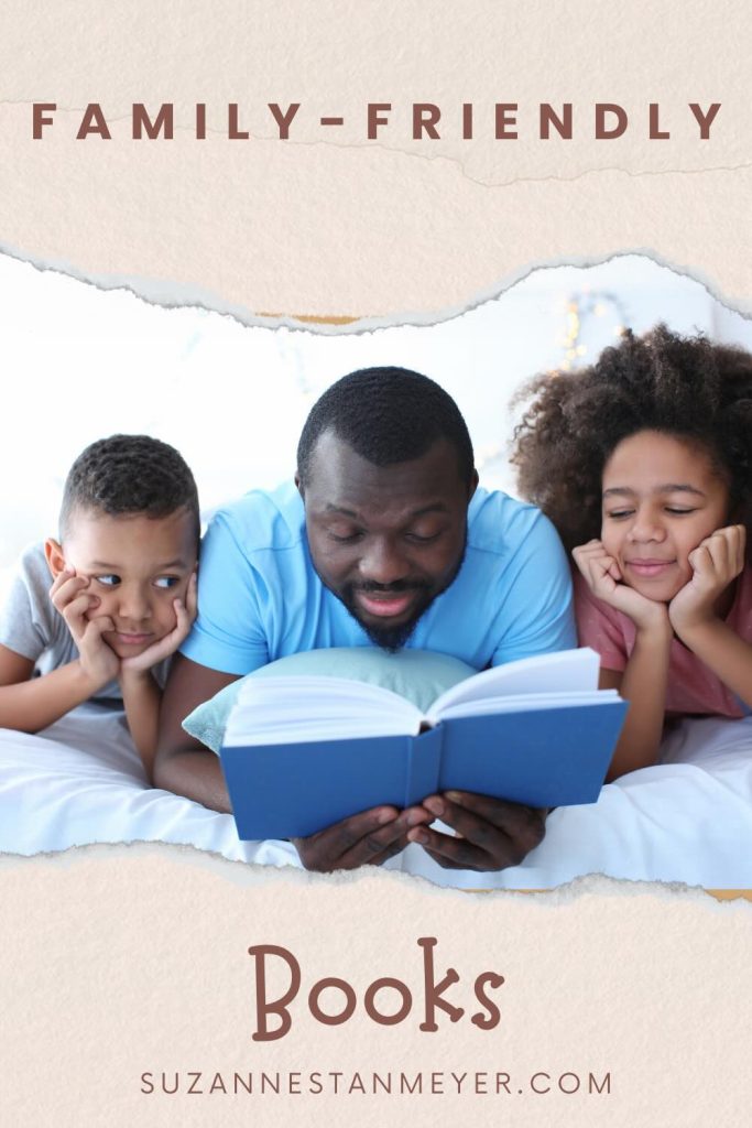 An African American father reading a book outloud to his son and daughter.